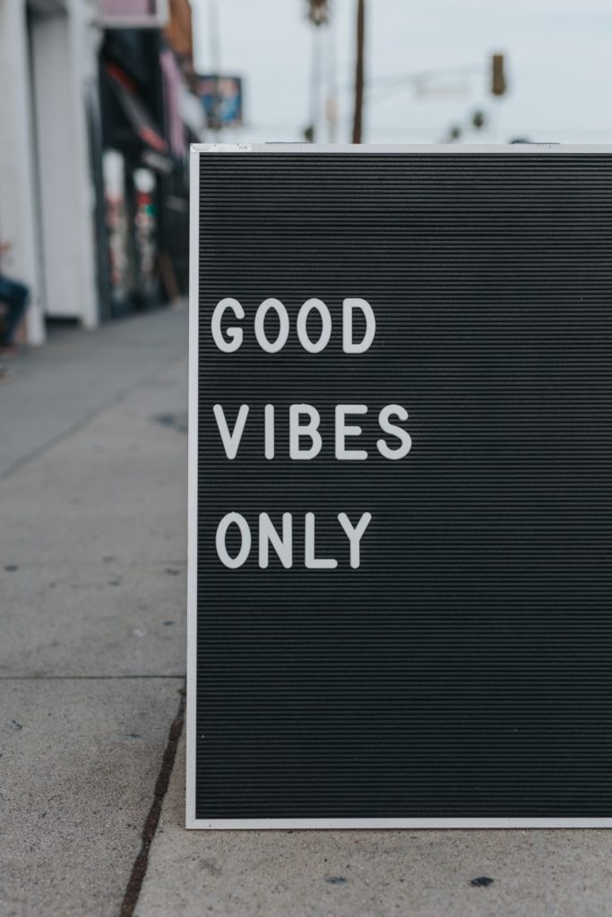 A black letterboard sign with the words Good Vibes Only